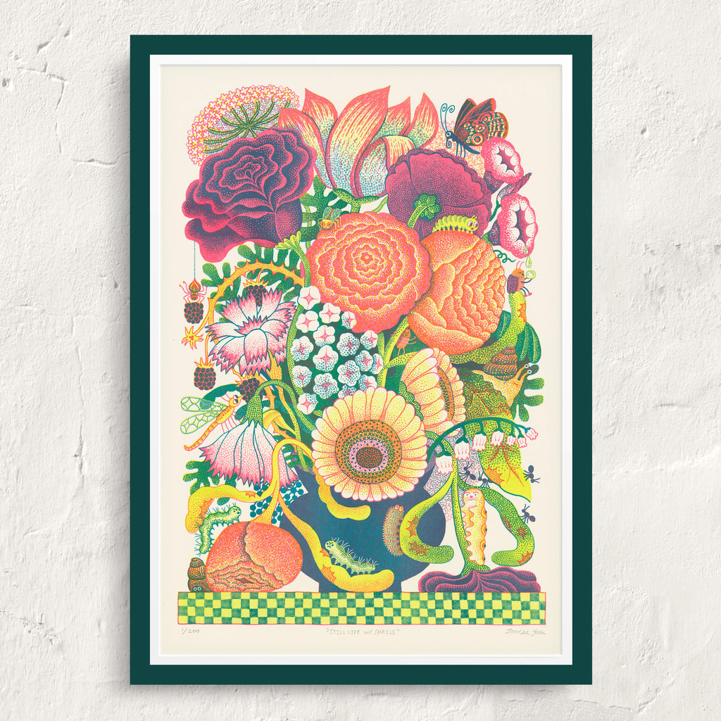 Colorful floral illustration in a green frame on a white wall