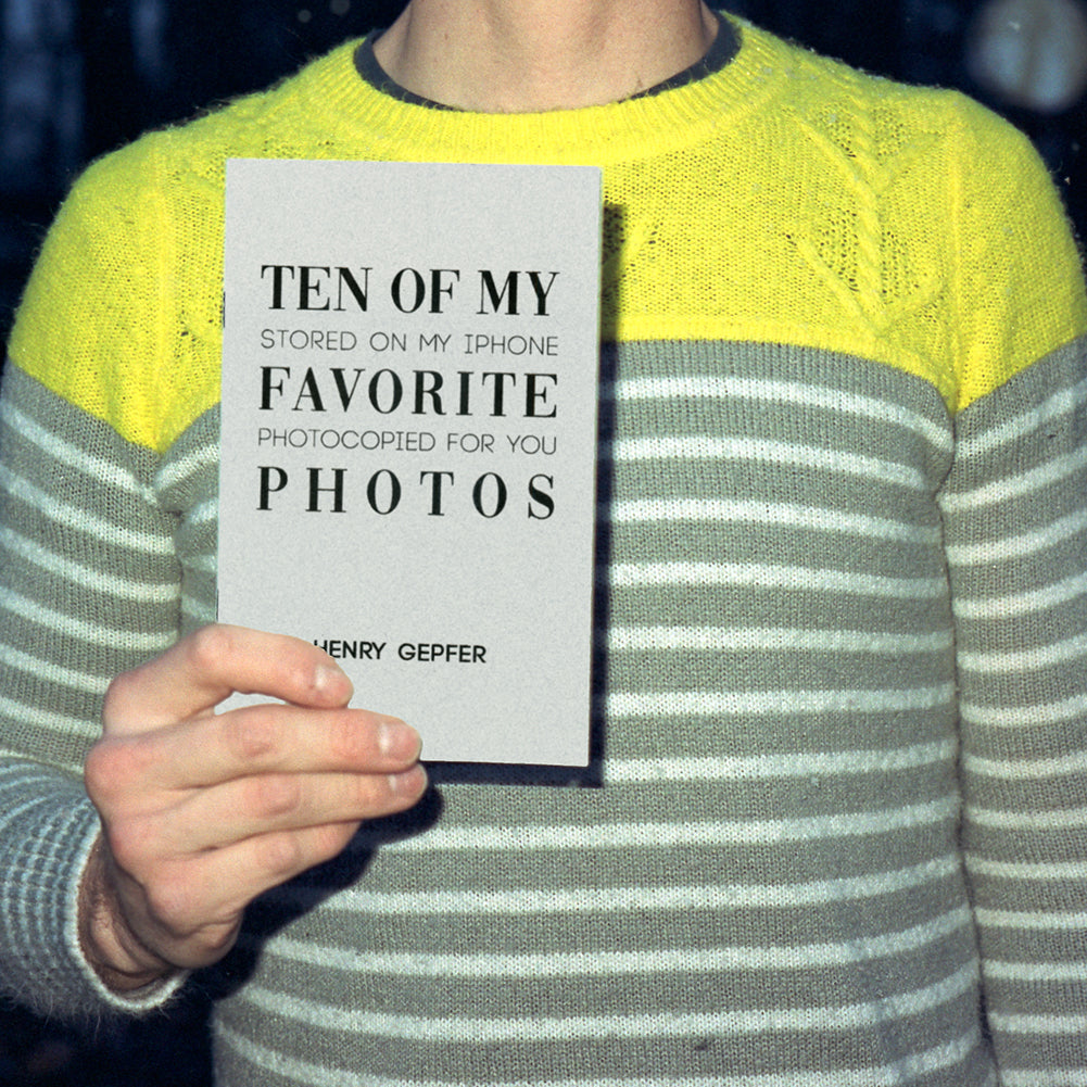 Henry Gepfer holding the "Ten of My Favorite Photos" zine